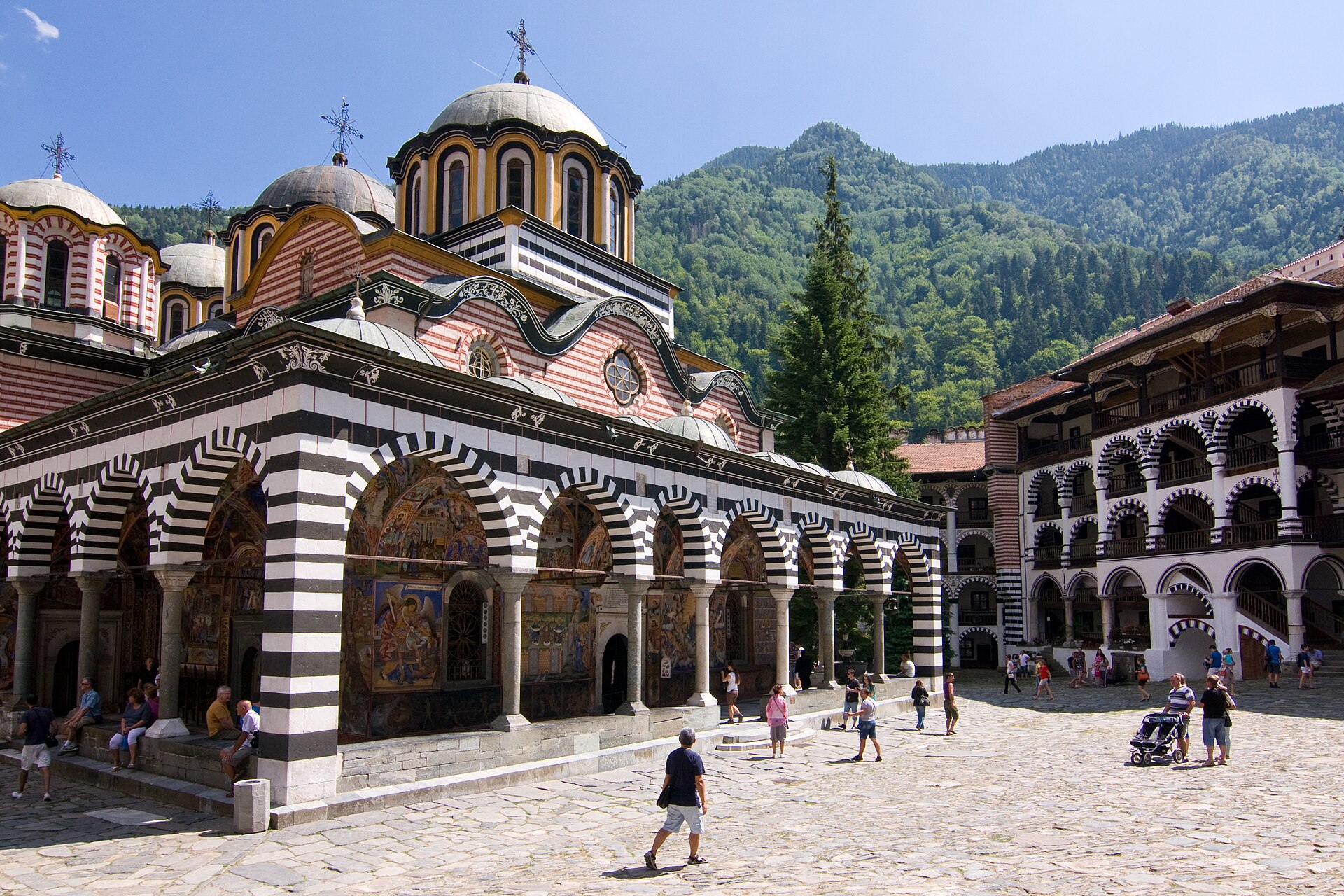 Rila Monastery's striped arcades and domed church in the Rila Mountains